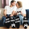 Happy couple wearing funny mens novelty socks with do not disturb I am gaming text.