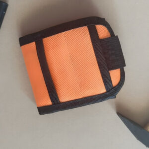 Magnetic wristband for tools shown with screws and a gift box on a white background.